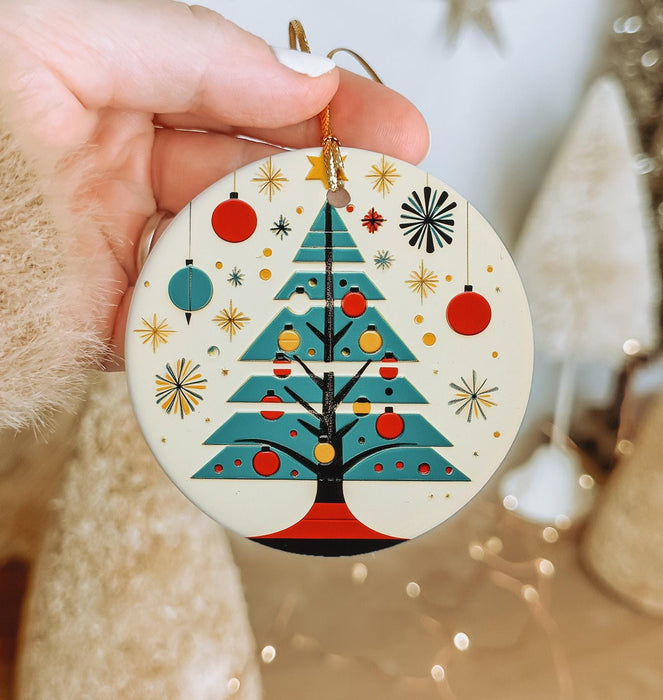 a person holding a christmas ornament in their hand