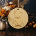 a ceramic ornament with a drawing of a teddy bear