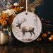 a ceramic ornament with a picture of a deer