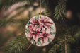 a ceramic ornament hanging from a christmas tree