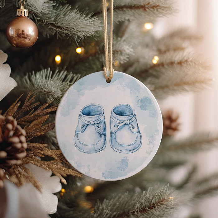 a ceramic ornament hanging from a christmas tree