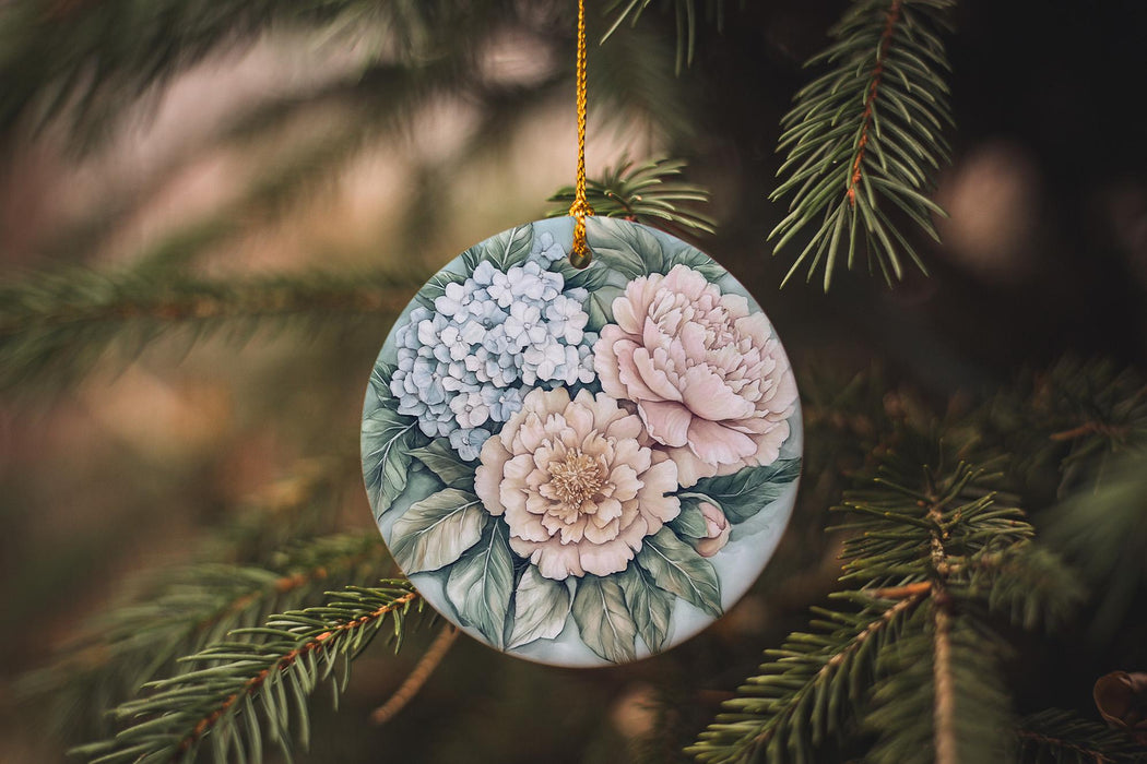 a ceramic ornament hanging from a christmas tree