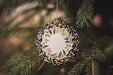 a christmas ornament hanging from a tree