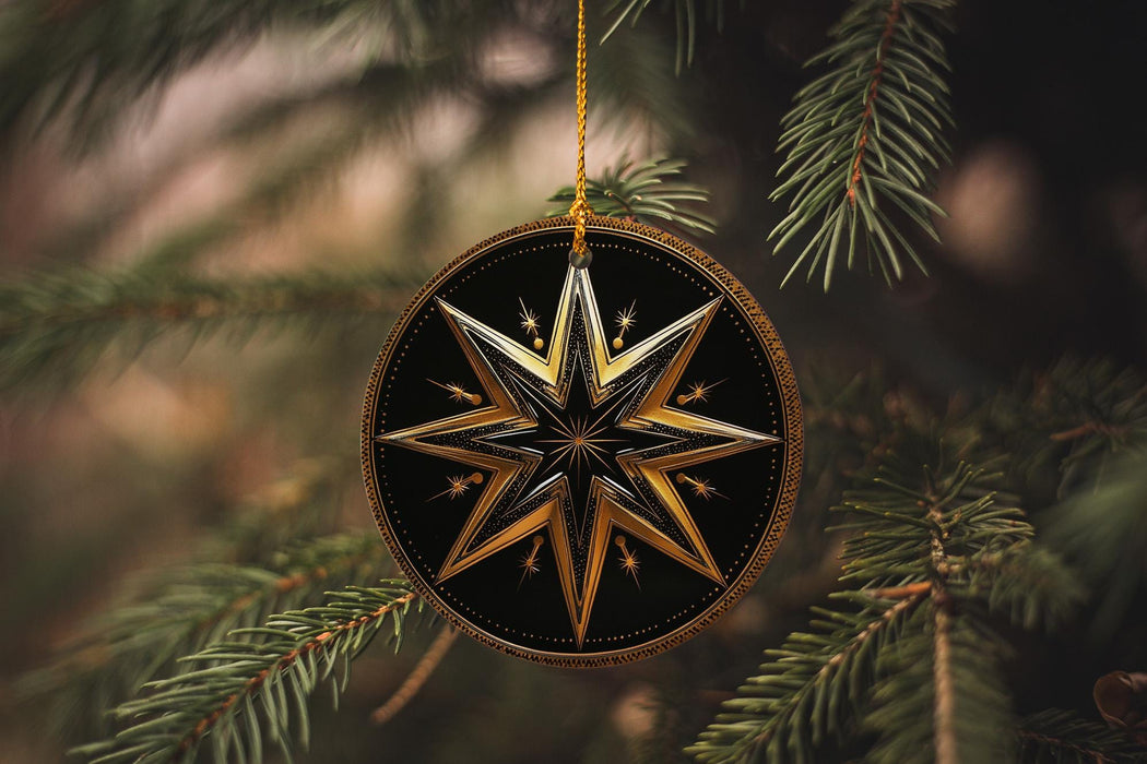 a star ornament hanging from a christmas tree