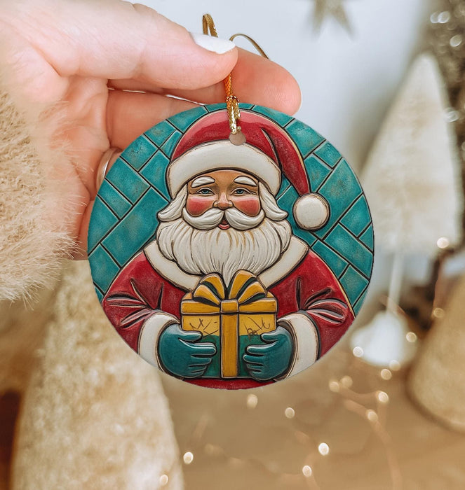 a person holding a christmas ornament in their hand