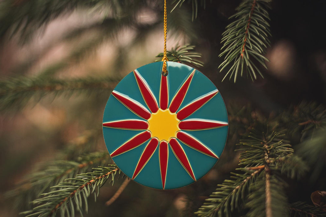 a christmas ornament hanging from a christmas tree