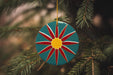 a christmas ornament hanging from a christmas tree