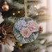 a christmas ornament hanging from a christmas tree