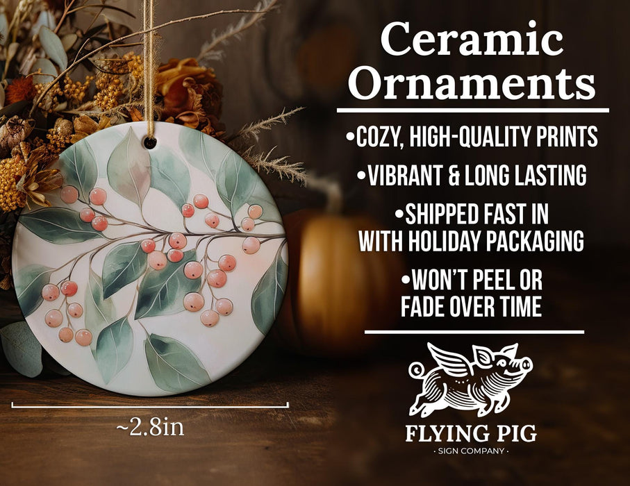 a ceramic ornament with berries and leaves on it