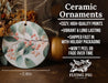 a ceramic ornament with berries and leaves on it