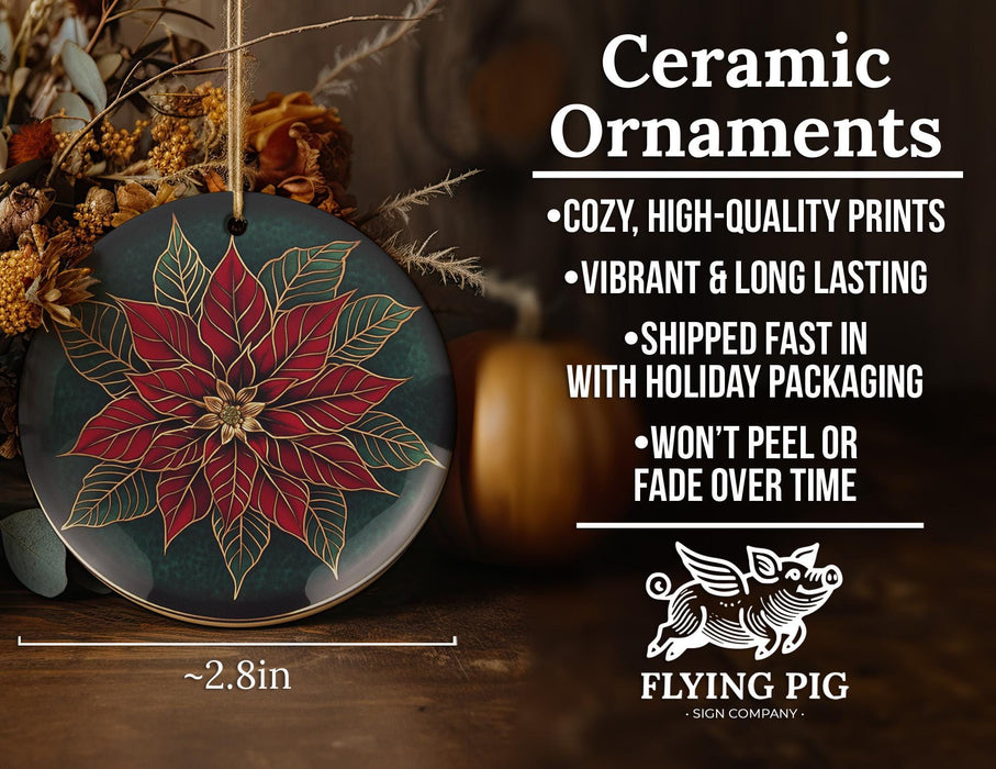 a ceramic ornament with a poinsetti on it