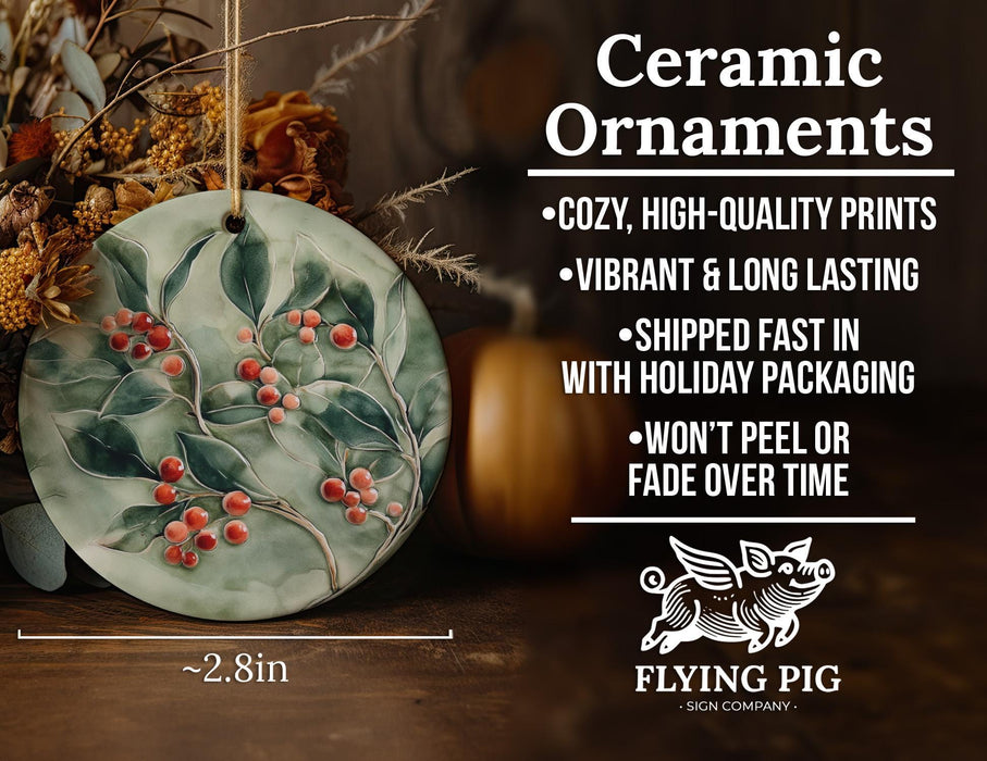 a ceramic ornament with berries and leaves on it