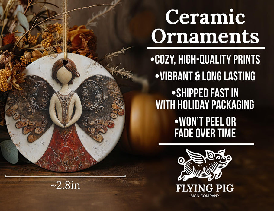 a ceramic ornament with a picture of an angel on it