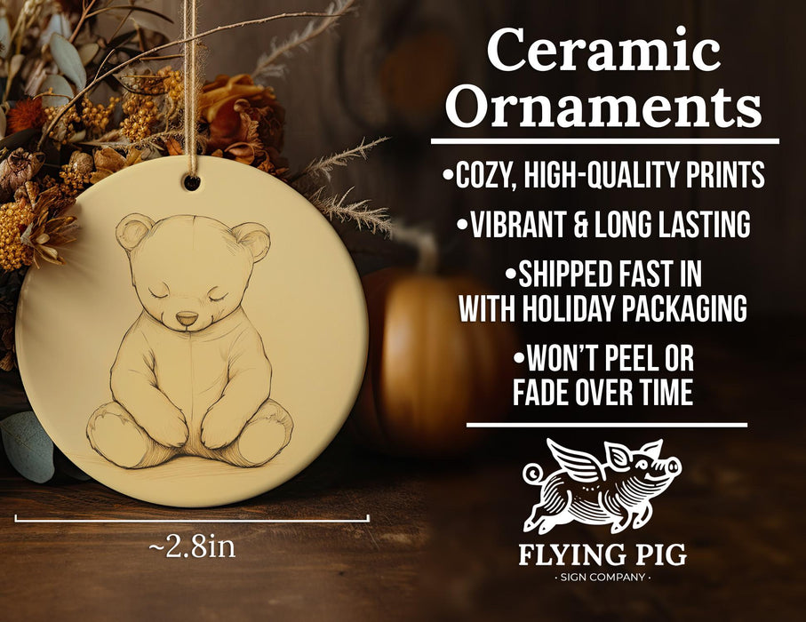 a ceramic ornament with a picture of a teddy bear
