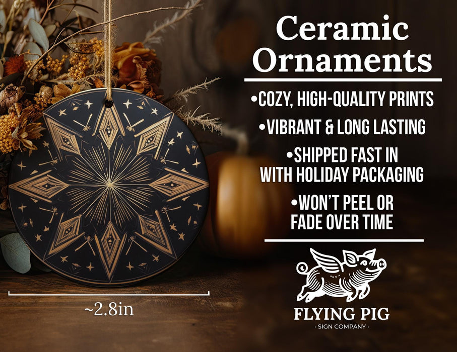 a black and gold ceramic ornament with a star design