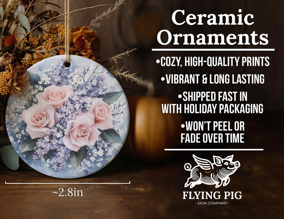a ceramic ornament with pink roses and baby's breath
