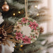 a christmas ornament hanging from a christmas tree