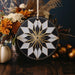 a black and white ornament sitting on top of a wooden table