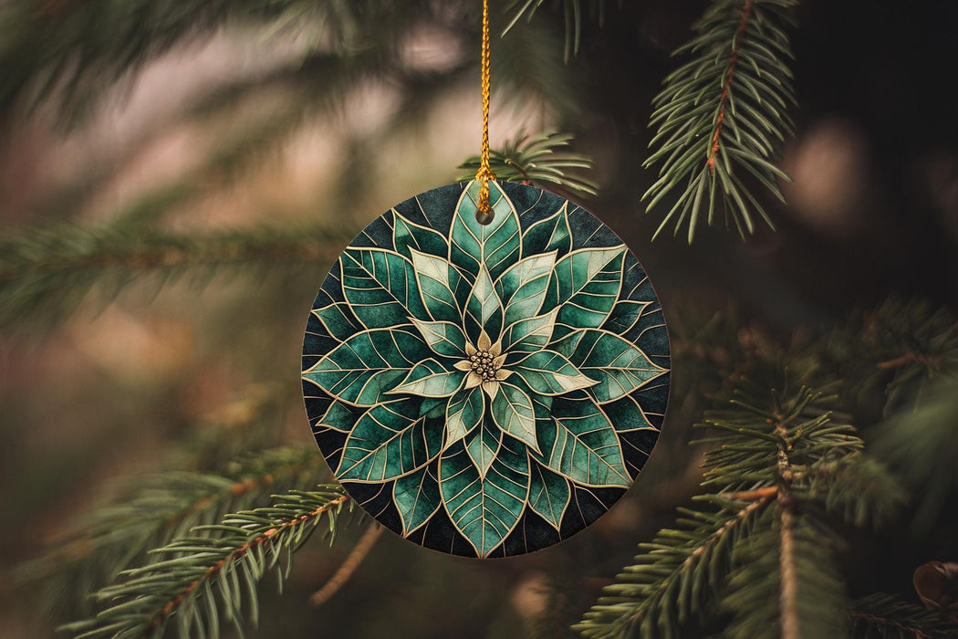 a green and white ornament hanging from a tree