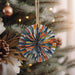 a christmas ornament hanging from a christmas tree