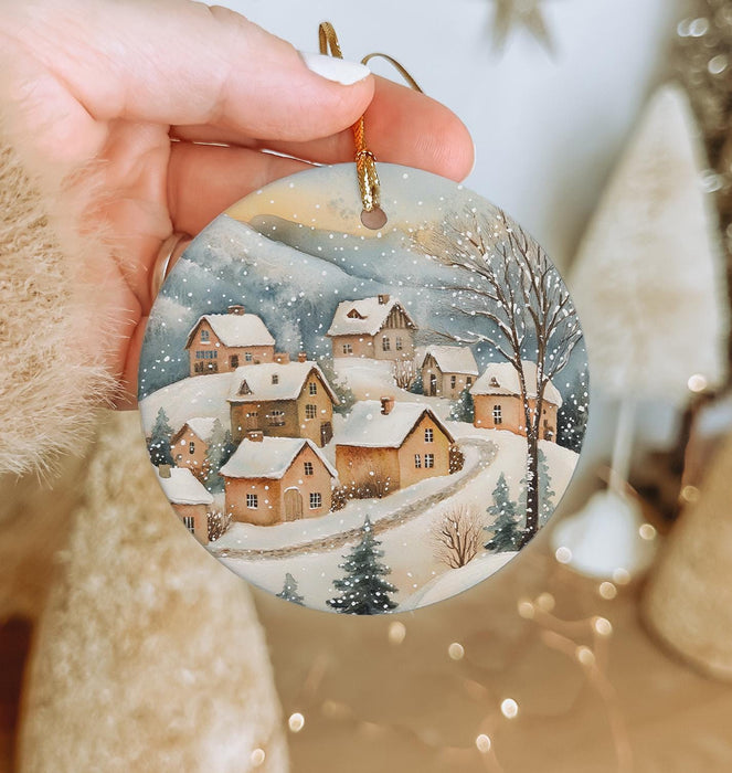 a person holding a christmas ornament in their hand