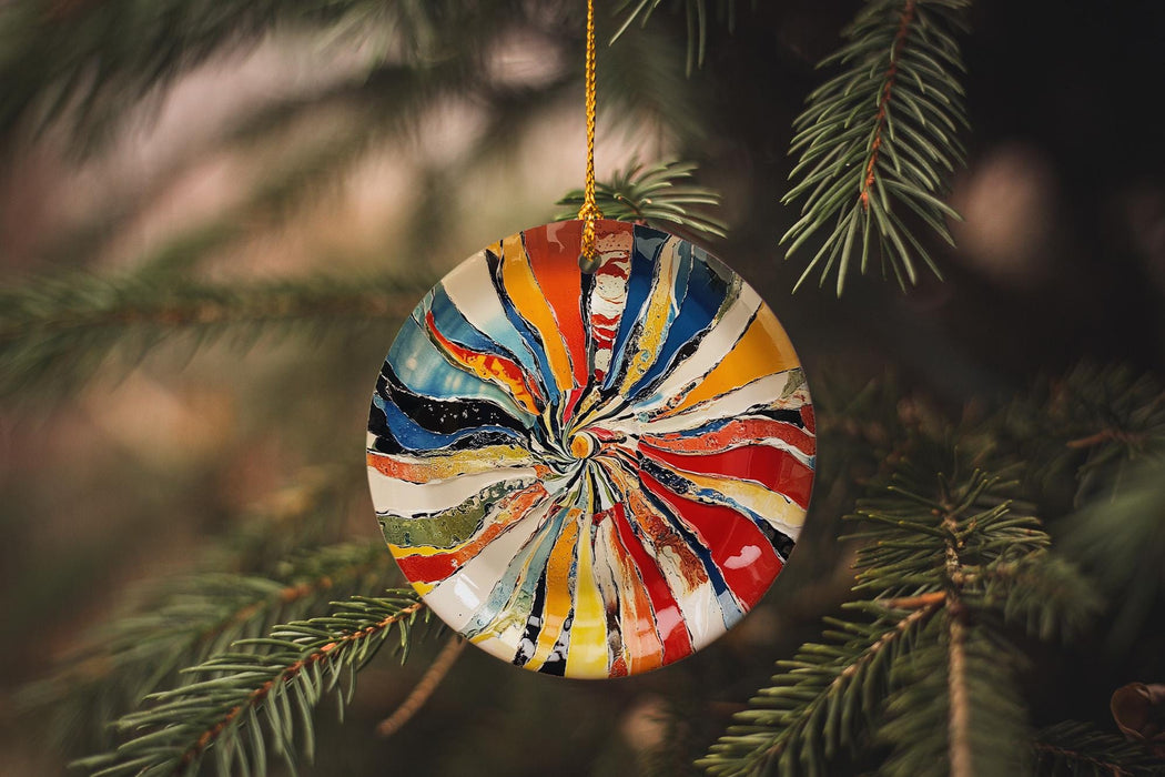 a colorful ornament hanging from a tree