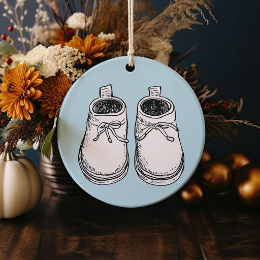 a ceramic ornament with a pair of shoes on it