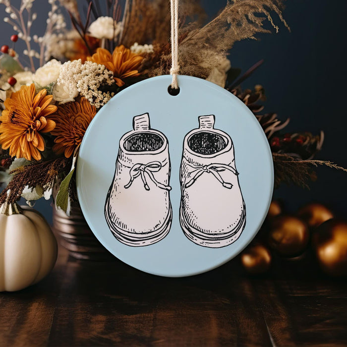 a ceramic ornament with a pair of shoes on it