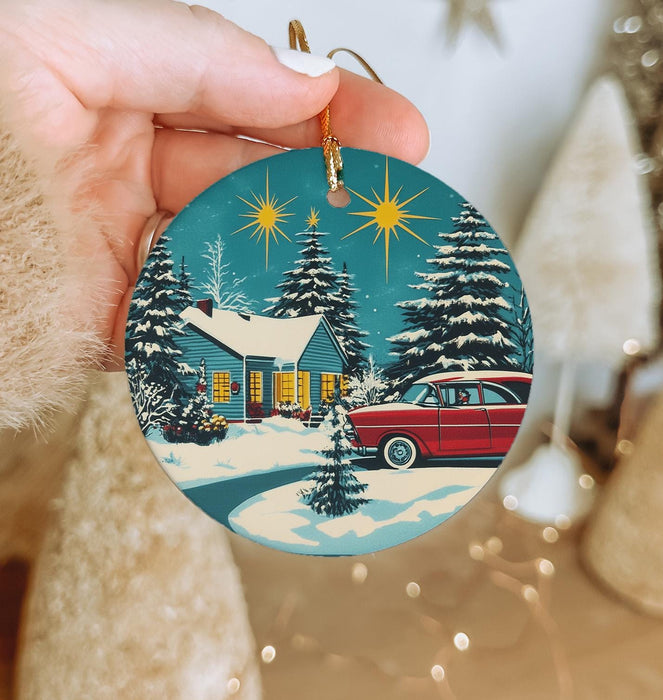 a person holding a christmas ornament in their hand