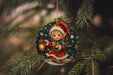 a christmas ornament hanging from a tree