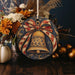 a christmas ornament with a bell on it