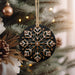 a snowflake ornament hanging from a christmas tree