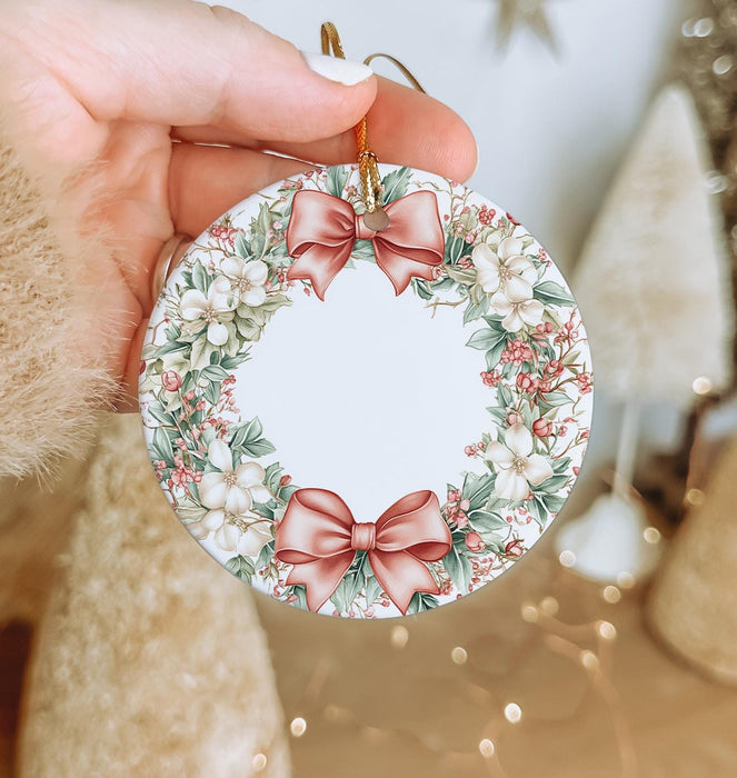 a person holding a christmas ornament in their hand