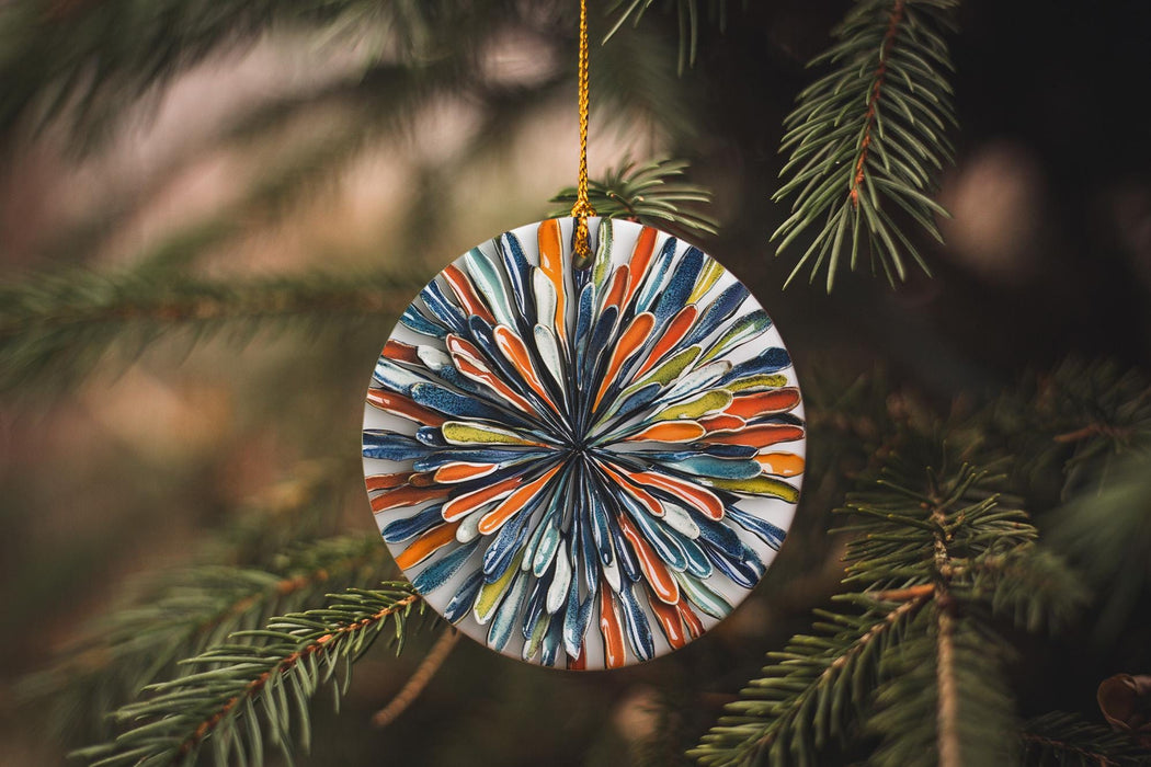 a glass ornament hanging from a christmas tree