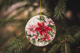 a ceramic ornament hanging from a christmas tree