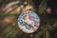 a ceramic ornament hanging from a christmas tree