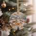 a christmas ornament hanging from a christmas tree