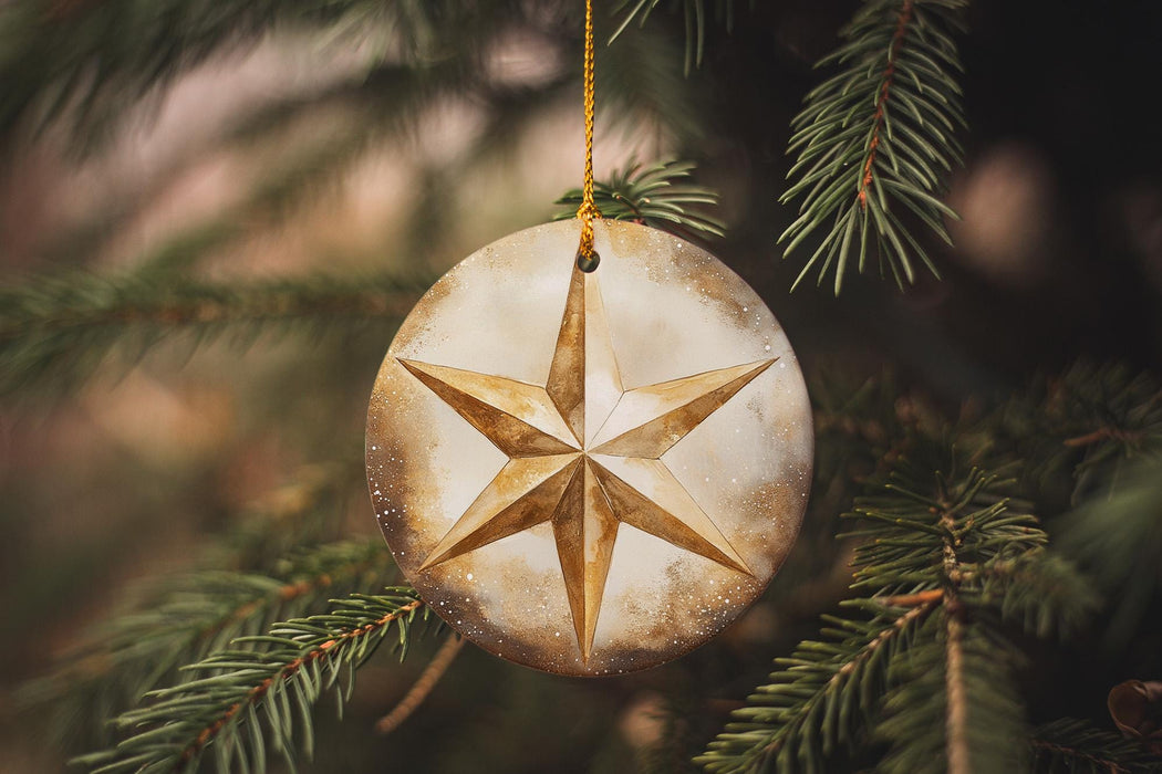 a star ornament hanging from a christmas tree