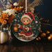 a christmas ornament with a little elf holding a lantern