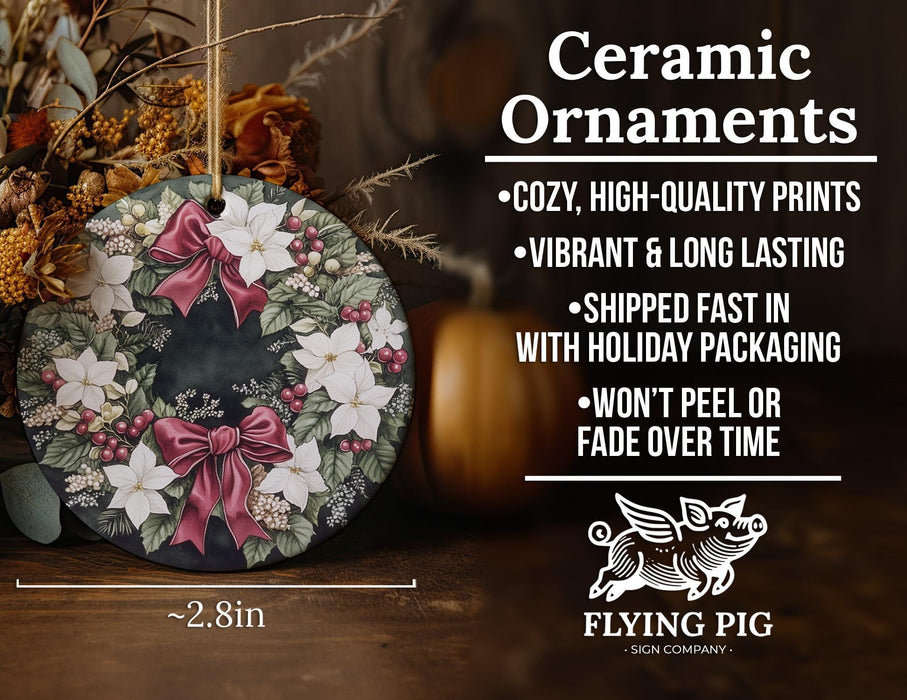 a ceramic ornament with flowers and bows on it