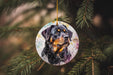 a dog ornament hanging from a christmas tree