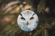 a ceramic ornament with an owl's face on it