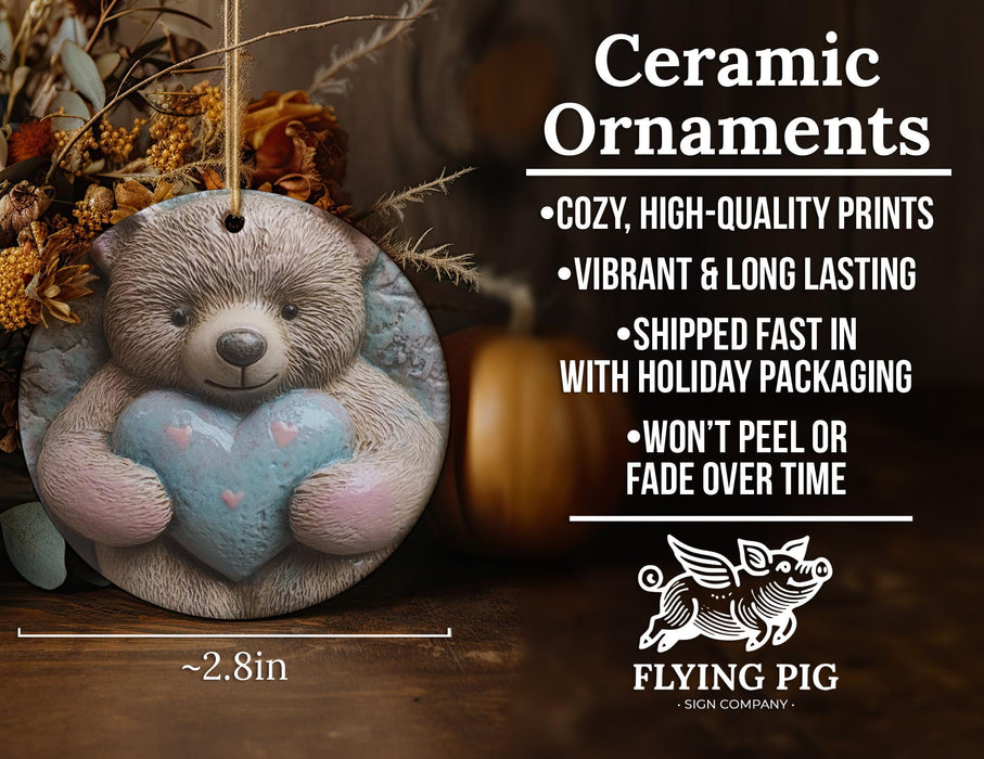 a ceramic ornament with a teddy bear holding a heart