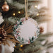 a christmas ornament hanging from a christmas tree