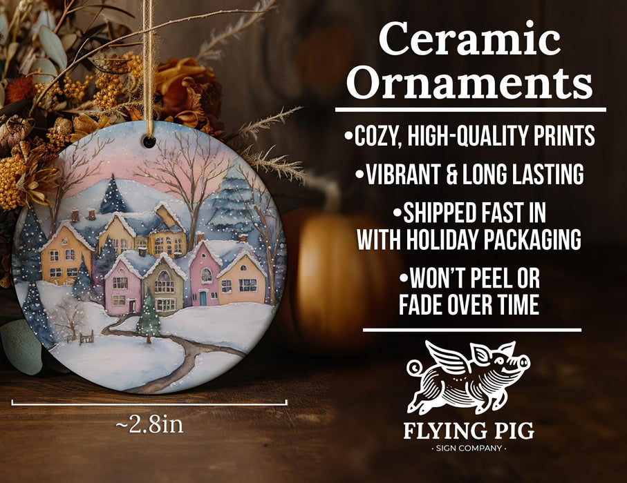 a ceramic ornament with a winter scene on it