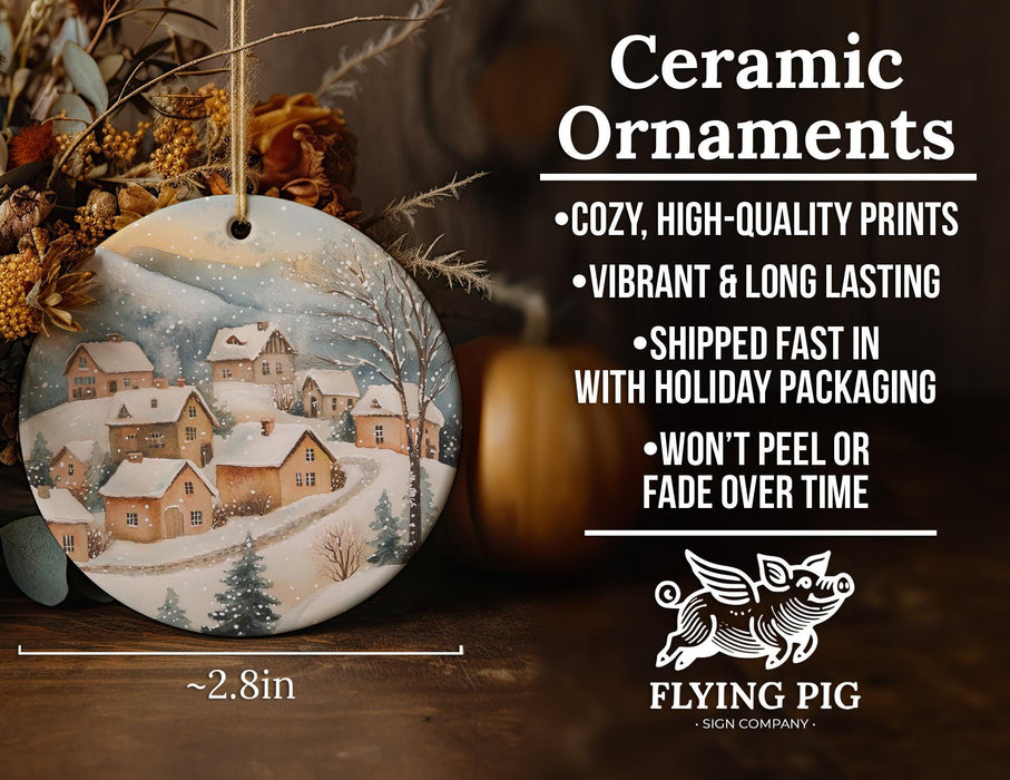 a ceramic ornament with a winter scene on it