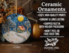 a ceramic christmas ornament with a snowy scene