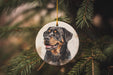 a dog ornament hanging from a christmas tree