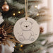 a christmas ornament hanging from a christmas tree