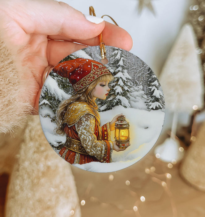 a person holding a christmas ornament in their hand